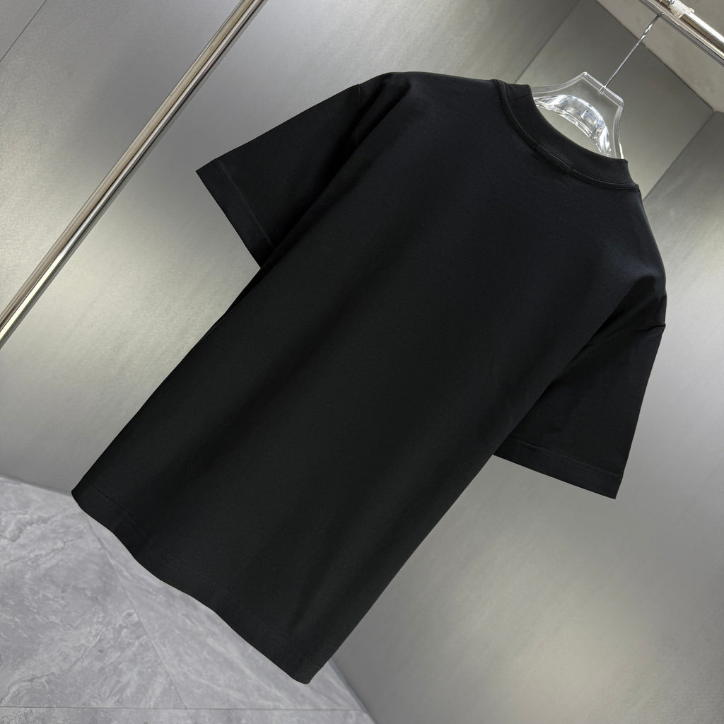 Black Gucci short-sleeve T-shirt plain design, angled view on a hanger