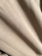 Beige long-sleeve fabric close-up