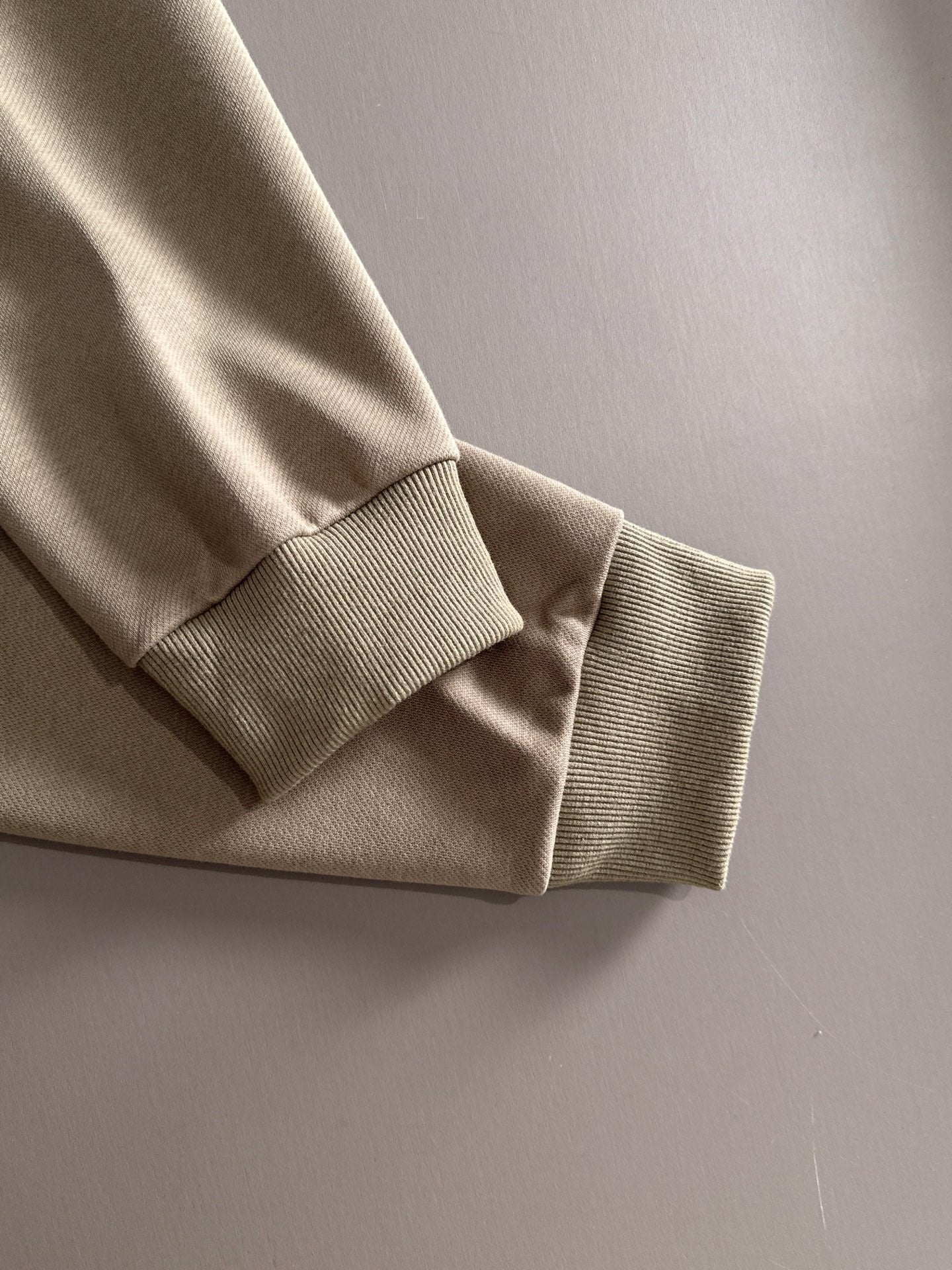 Beige long-sleeve polo with ribbed cuff