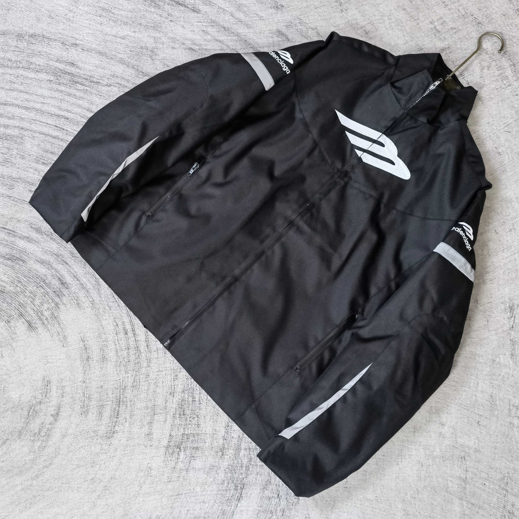 Black zip-up jacket with white Balenciaga emblem and stitched logo details