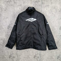 Black zip-up jacket with stand collar and white Balenciaga logo on the chest
