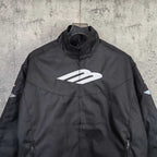 Black zip-up jacket with stand collar and large white Balenciaga logo on the chest