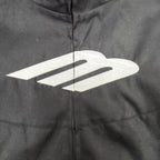 Black jacket close-up with large white Balenciaga emblem over the center zipper