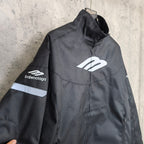 Black zip-up jacket with white Balenciaga chest emblem and “balenciaga” sleeve logo