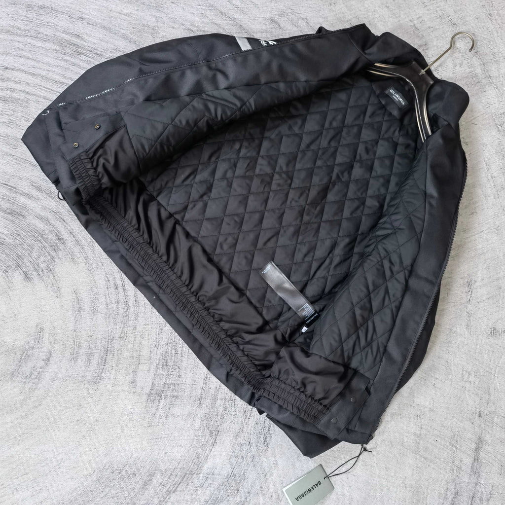 Black quilted jacket lining with attached hoodless interior panels and drawcord ties