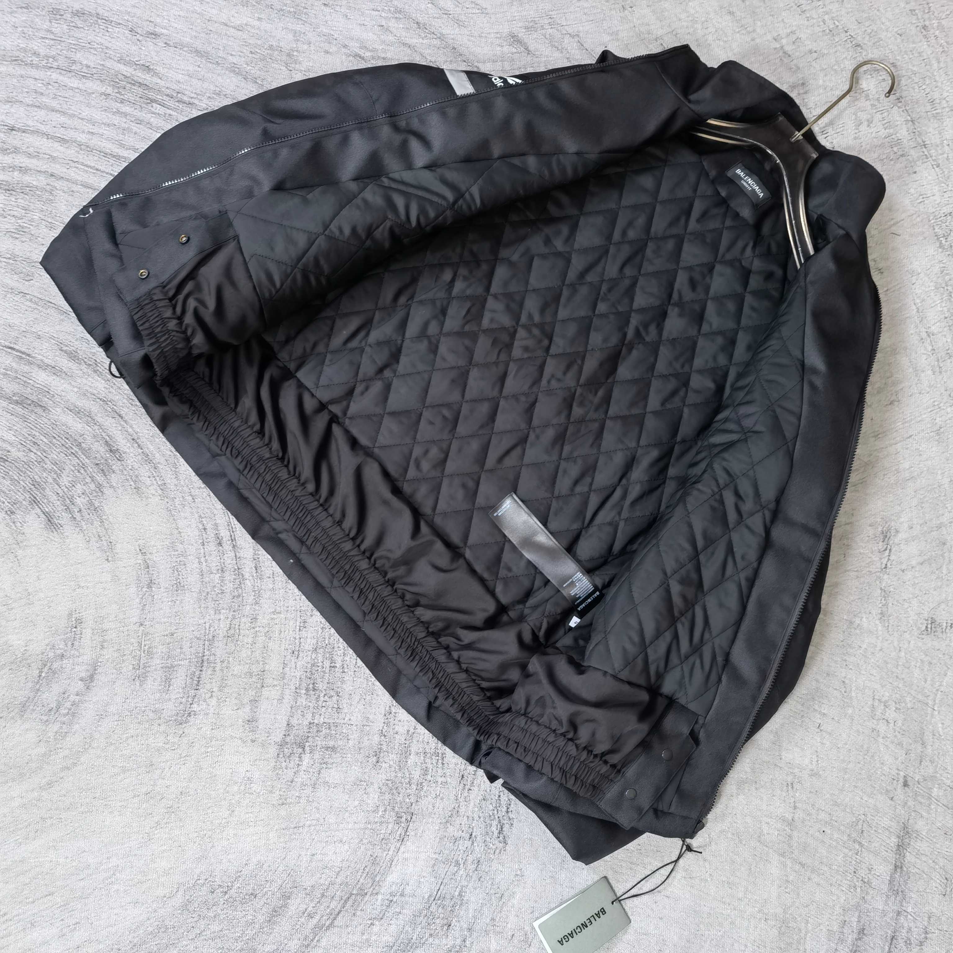 Black quilted jacket lining with attached hoodless interior panels and drawcord ties