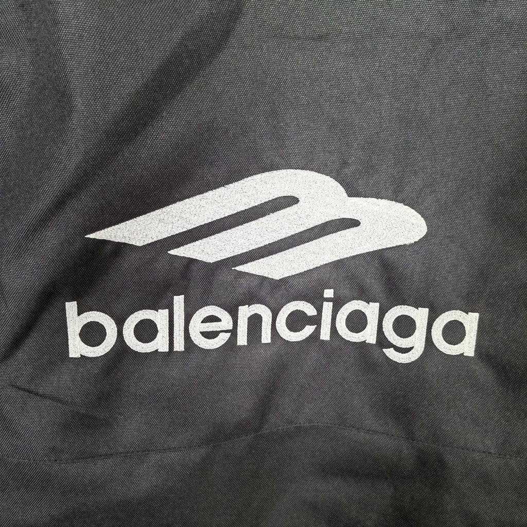 Balenciaga logo print on dark charcoal hooded jacket fabric