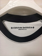 Long-sleeve raglan shirt neckline detail: black-trim crew neck with small logo text