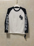 Long-sleeve raglan shirt, white body with black sleeves and front graphic print.