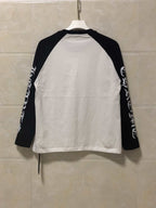 Raglan long-sleeve shirt, white body with black raglan sleeves and printed lettering