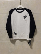 Long-sleeve raglan T-shirt, white with black sleeves and chest cross graphic