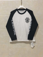 Raglan long-sleeve shirt, white body with black sleeves and crest graphic at chest