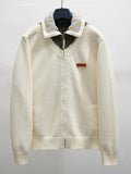Ivory knit zip-up jacket with striped ribbed collar and pearl-button placket