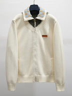 Ivory knit zip-up jacket with striped ribbed collar and pearl-button placket