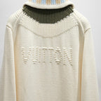 Ivory knit back with ribbed collar and raised LV-style lettering