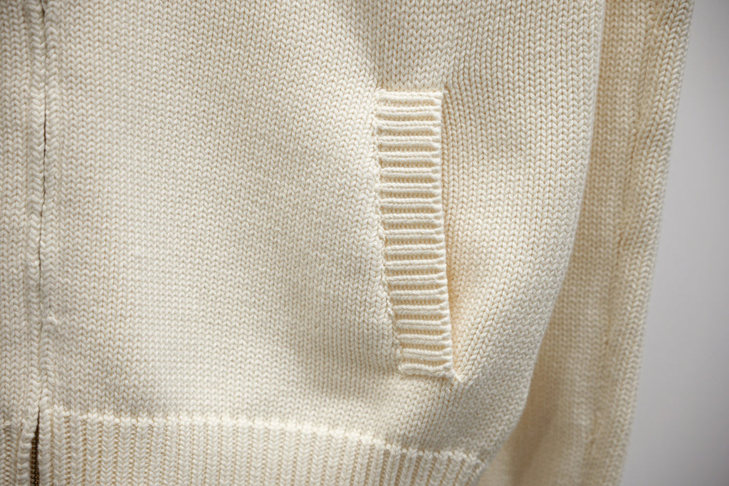 Ivory knit zip-up panel with ribbed seam detailing