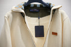 Ivory knit zip-up jacket with Louis Vuitton hang tag and inner neckline trim