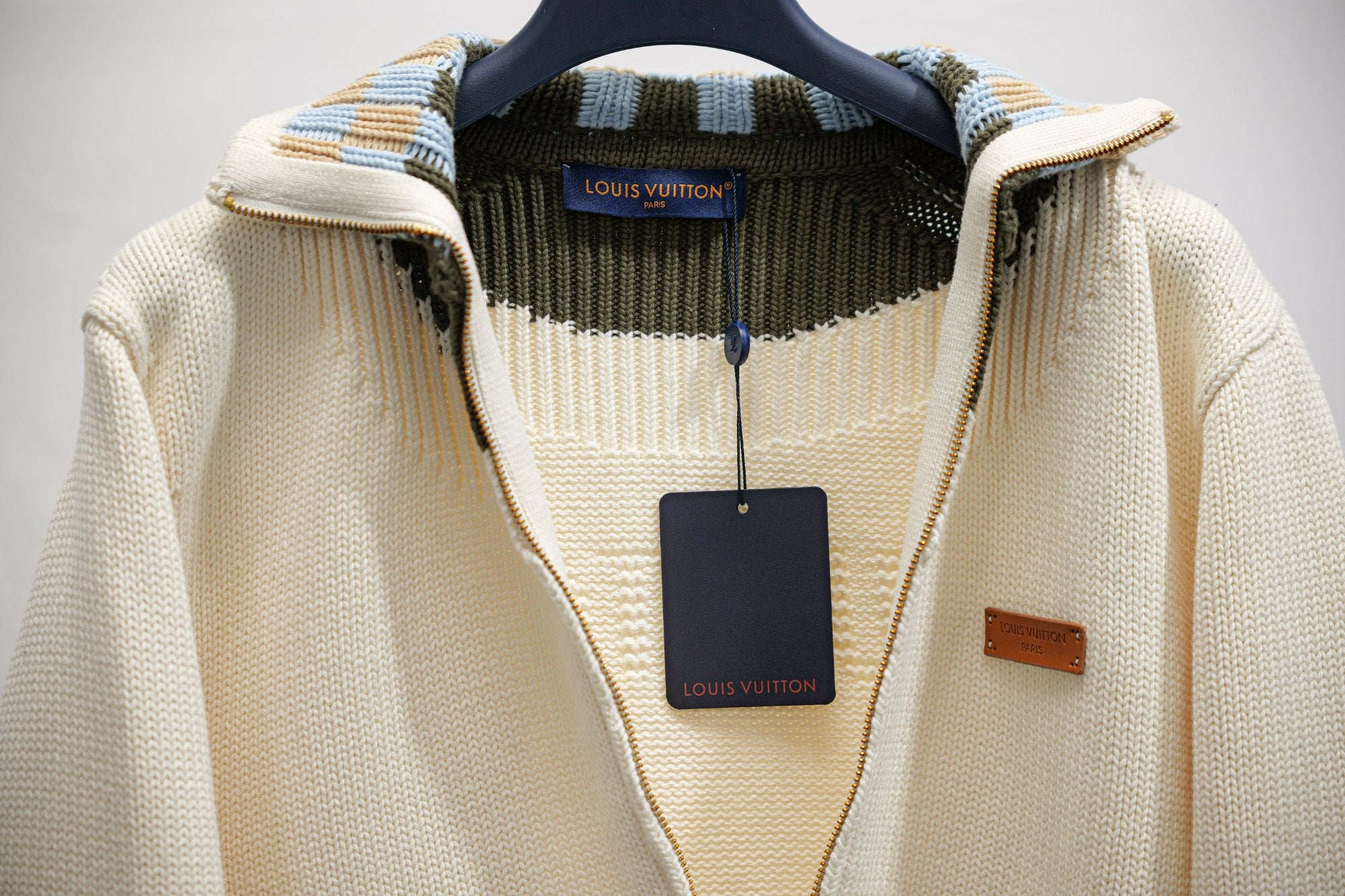 Ivory knit zip-up jacket with Louis Vuitton hang tag and inner neckline trim