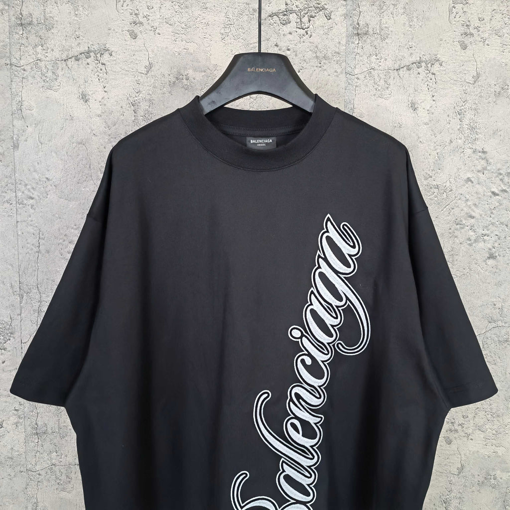 Balenciaga T-shirt in dark navy with white script logo on the front