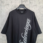 Balenciaga T-shirt in dark navy with white script logo on the front