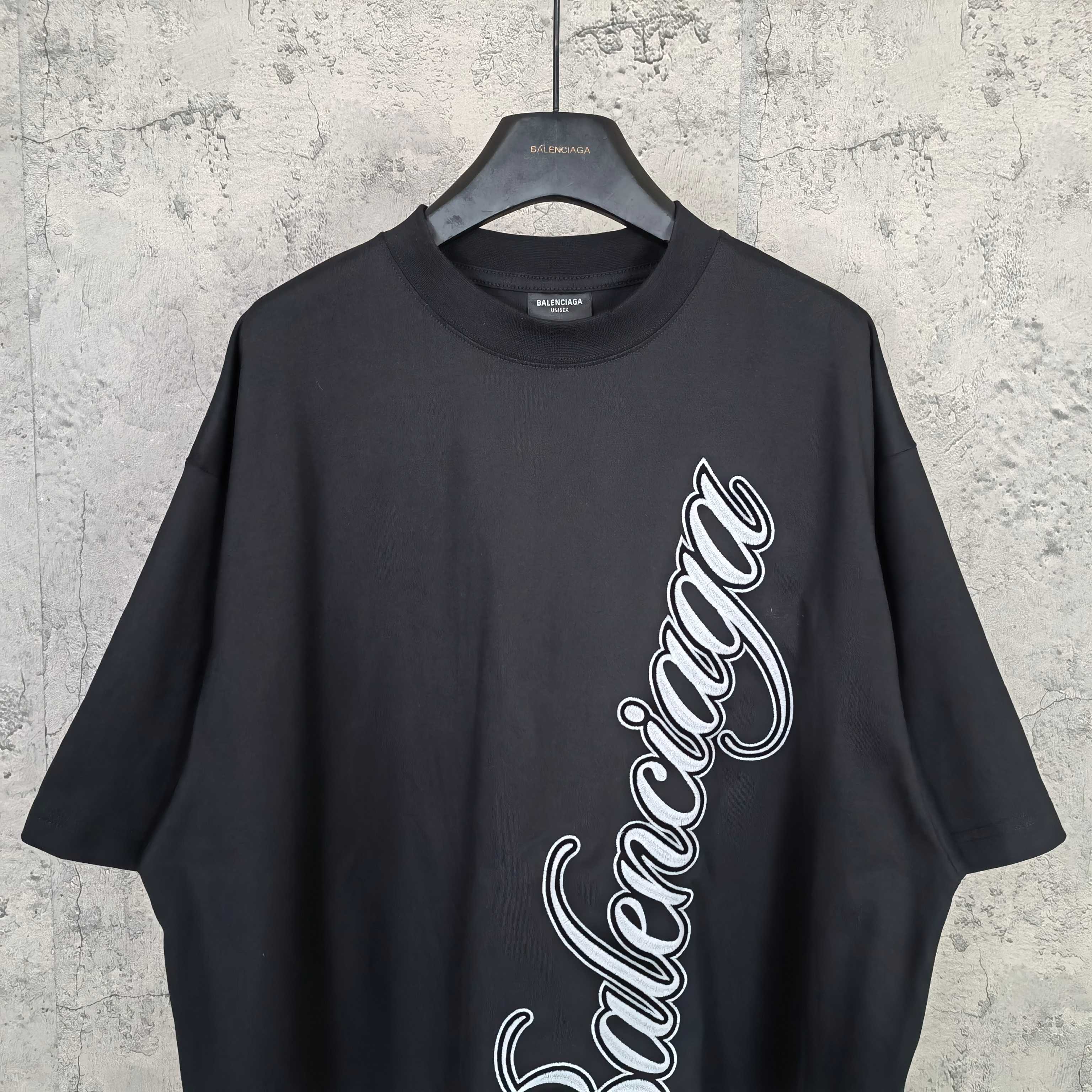 Balenciaga T-shirt in dark navy with white script logo on the front