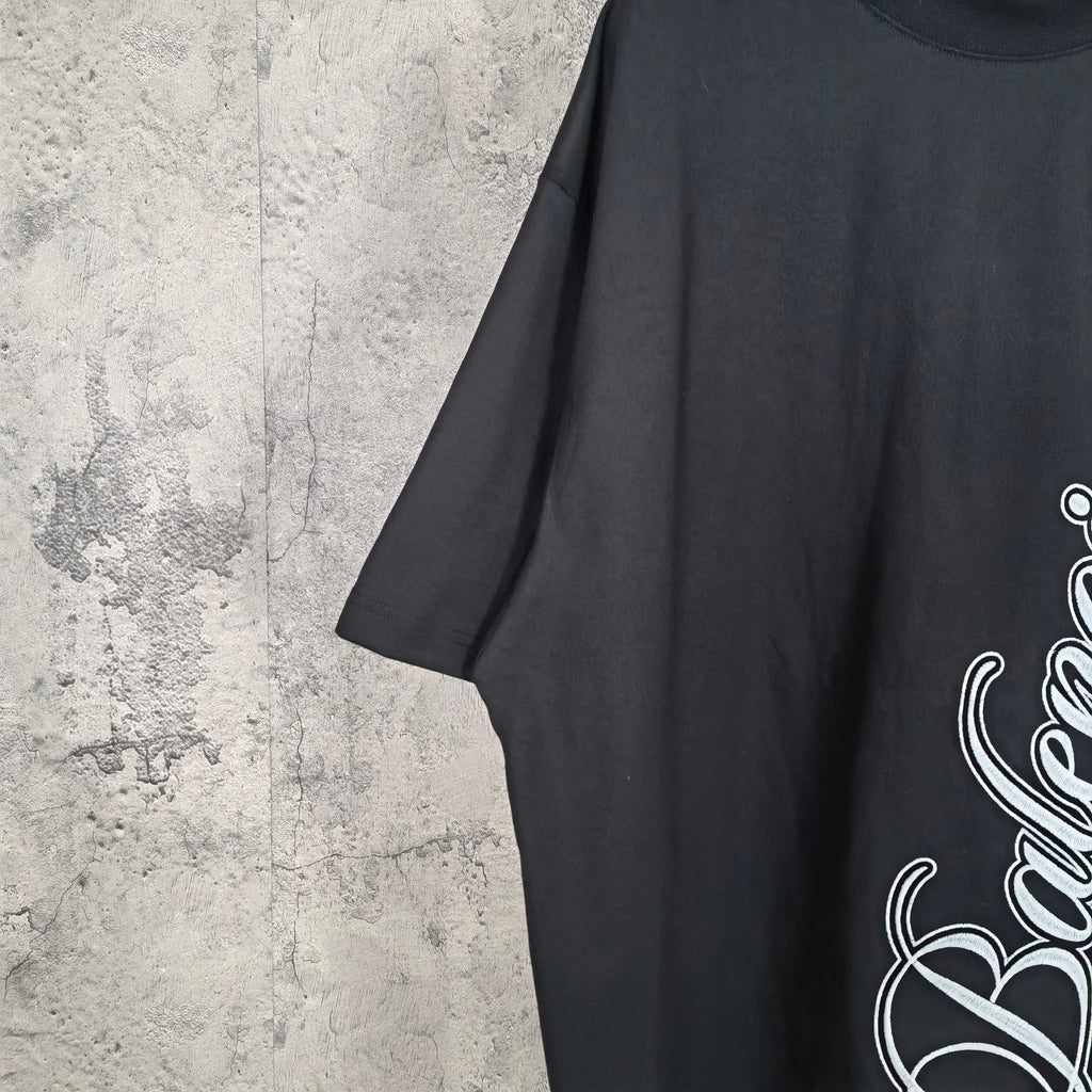 Balenciaga black short-sleeve T-shirt sleeve and side with partial logo