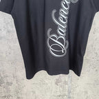 Balenciaga black short-sleeve T-shirt with white script logo close-up