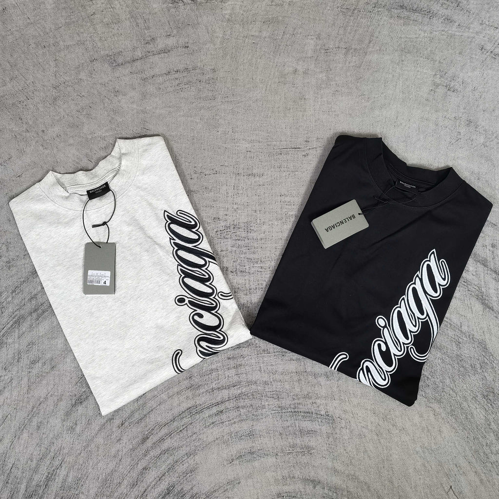 Two T-shirts: one white and one dark navy, each with Balenciaga script logo
