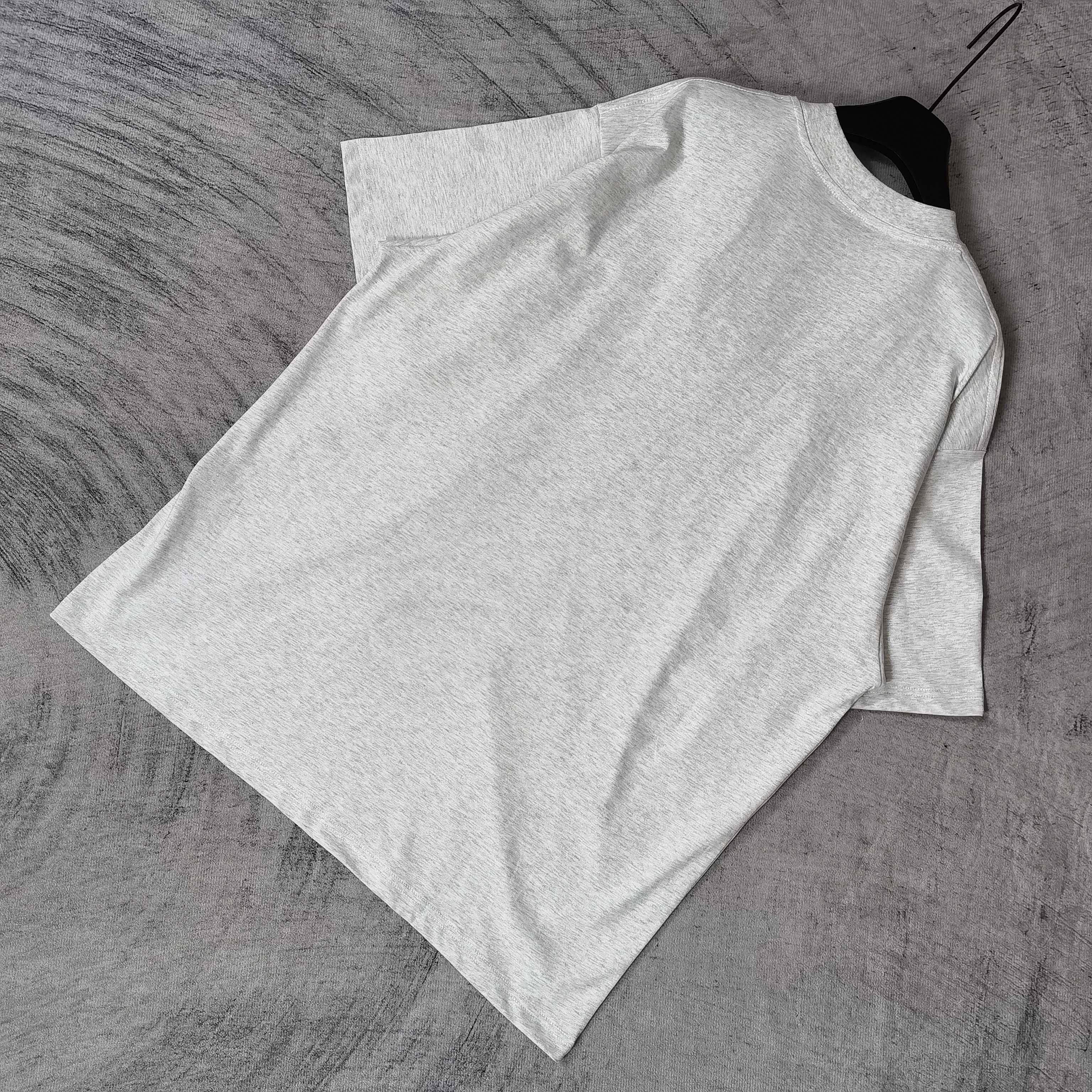 Balenciaga T-shirt, light gray, crew neck, short sleeves, plain back, folded.