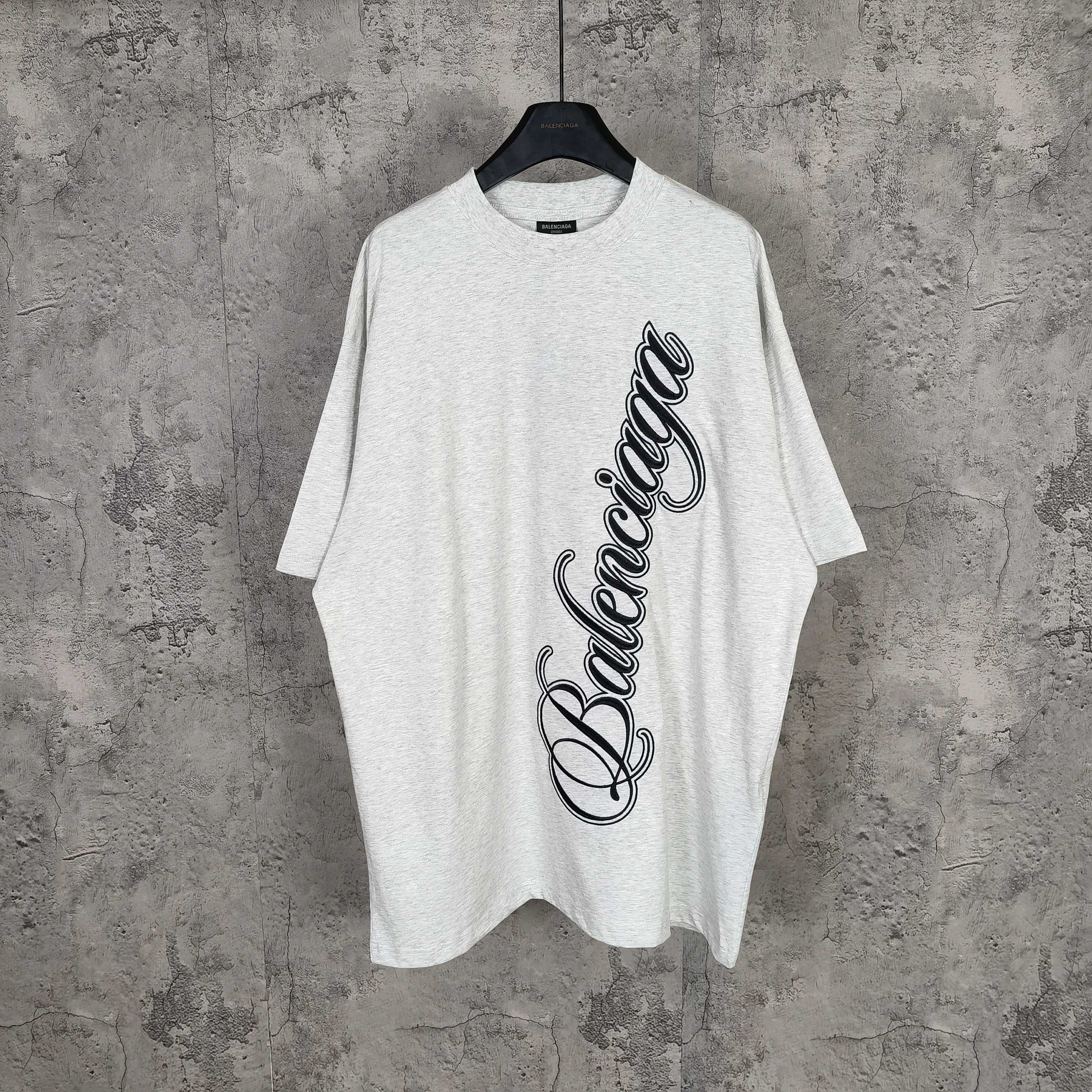 Balenciaga T-shirt, light gray, crew neck, short sleeves, black script logo front.