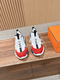 Unisex sneaker with red and navy panels, white laces, black heel tab, chunky sole