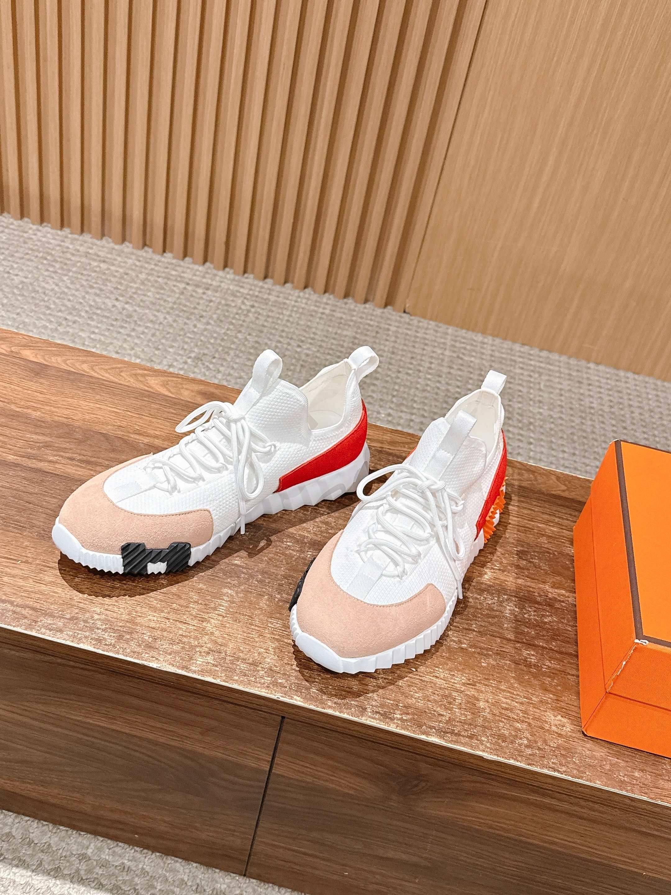 Hermes unisex sneakers, white knit uppers with red stripe and black tread soles