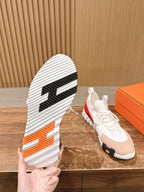 Hermes unisex sneakers, outsole view with white ridged tread and black center stripe