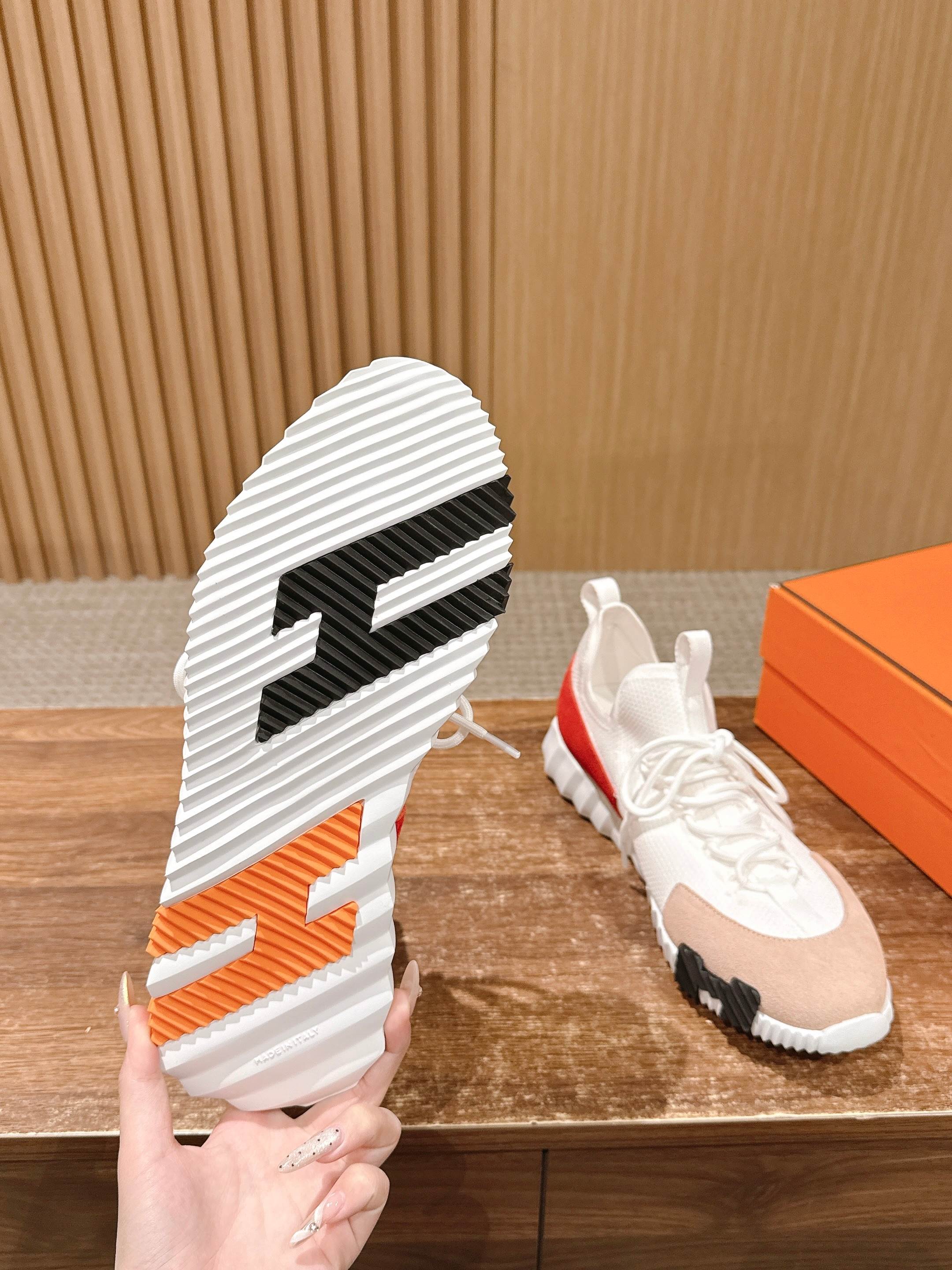 Hermes unisex sneakers, outsole view with white ridged tread and black center stripe