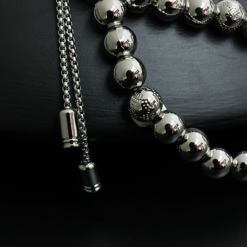 Louis Vuitton beaded necklace strand with round silver beads and chain tassel end caps