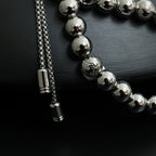 Louis Vuitton beaded necklace strand with round silver beads and chain tassel end caps