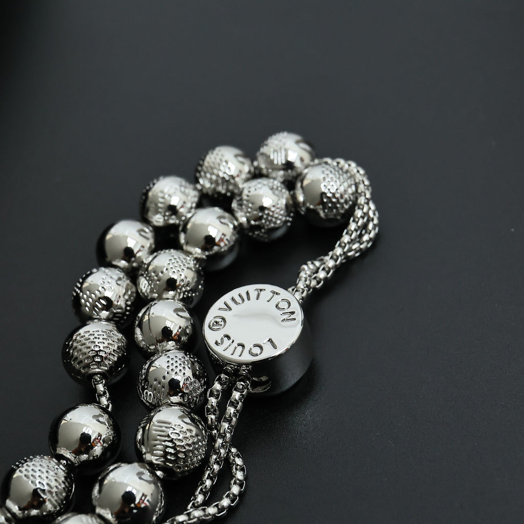 Beaded necklace with round logo charm and silver-toned spherical bead strands