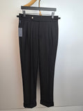 Black dress pants with waistband, front pleats, and concealed button closure