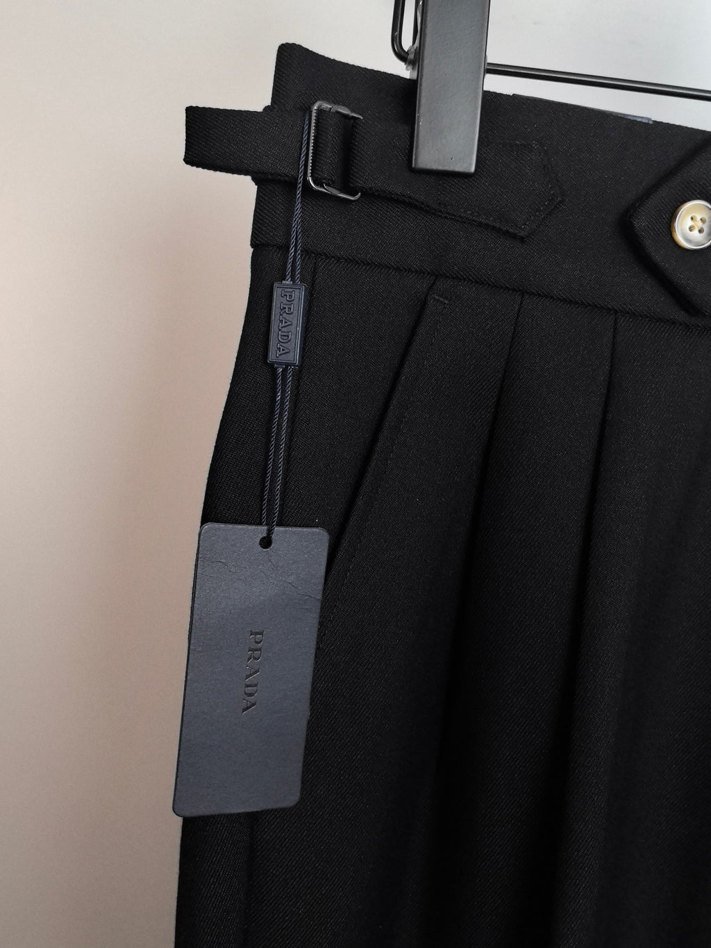 Black dress pants with side welt pocket and belt loop detail