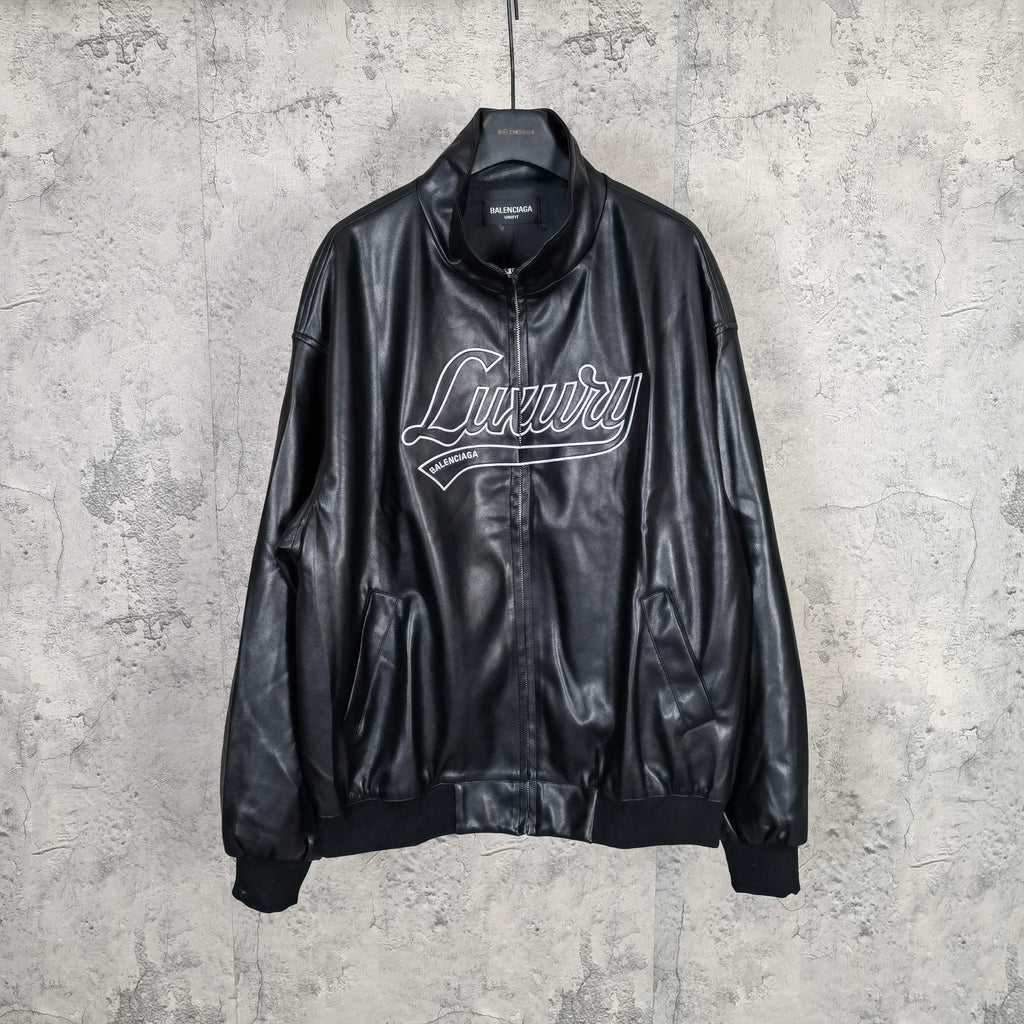 Black leather jacket with stand collar, front zip, and white “Luxury” graphic