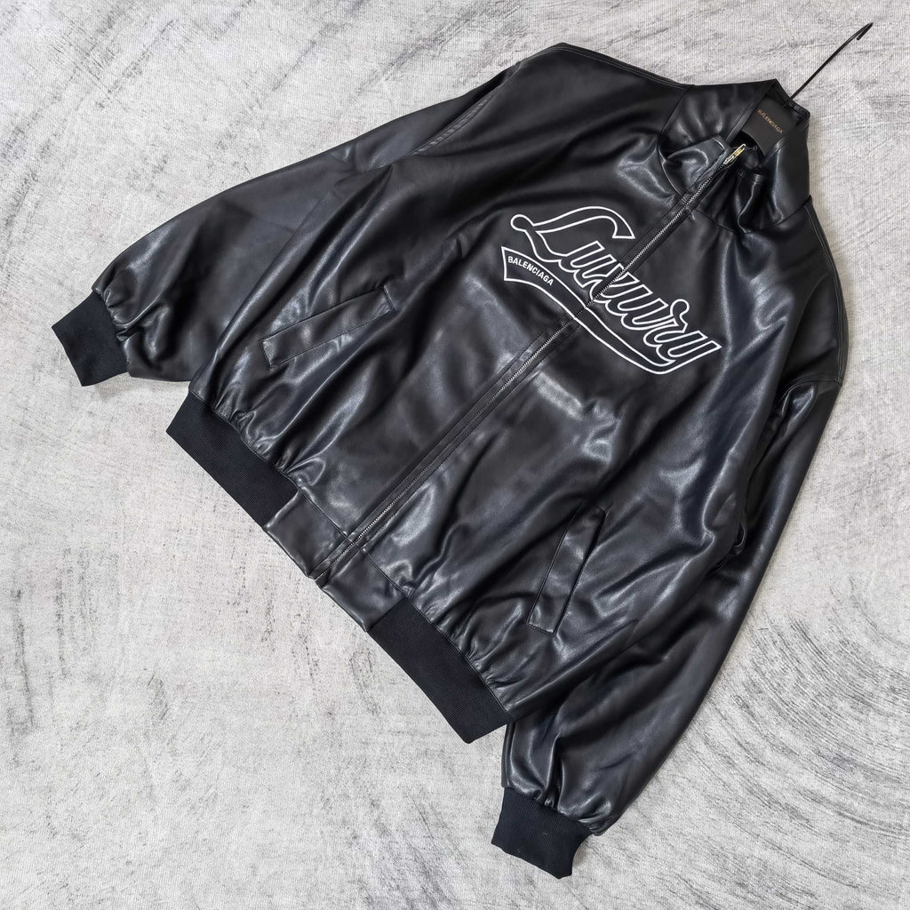 Black leather jacket with “Luxury” graphic on the front and zip closure