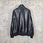Black leather jacket back view with ribbed hem and sleeves