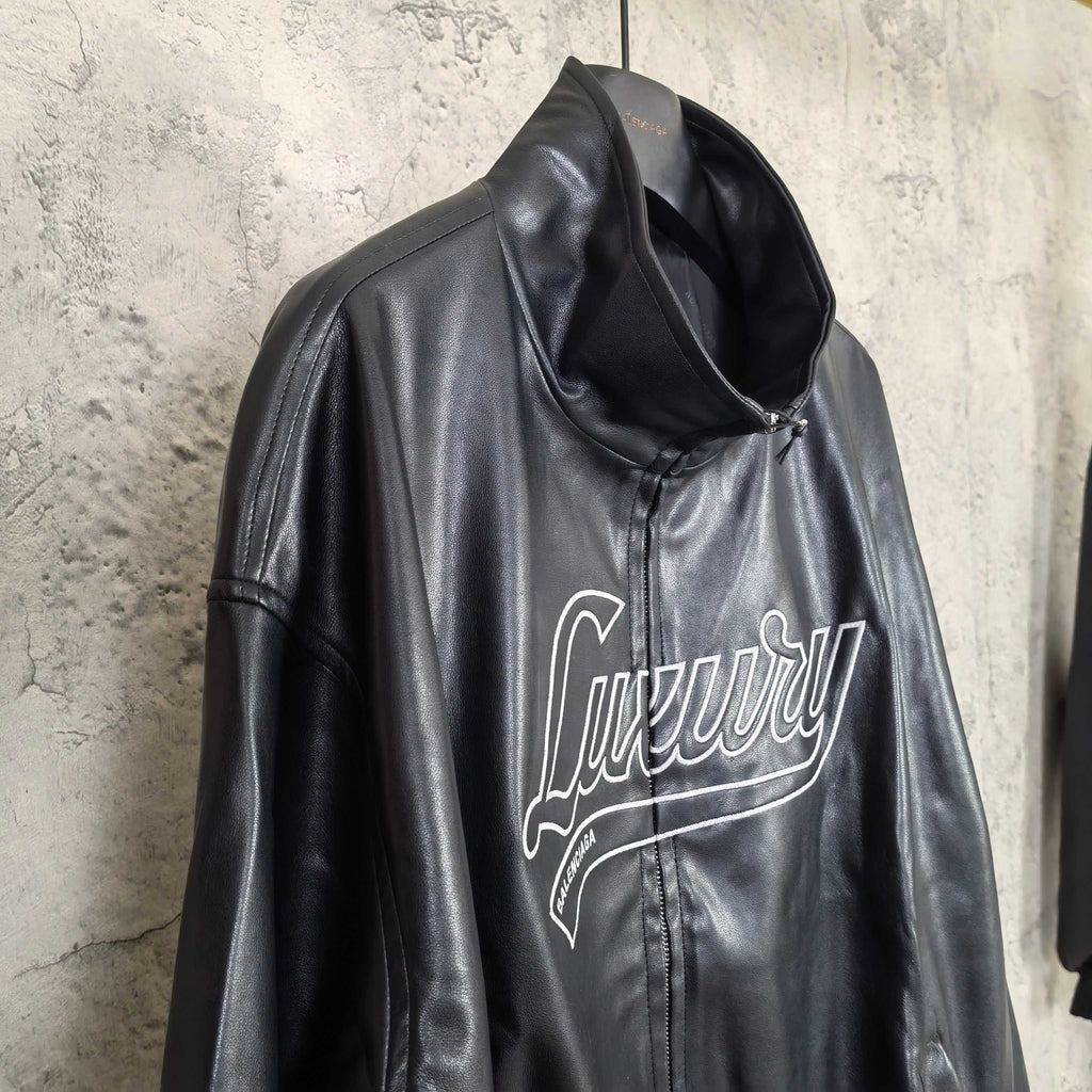 Dark leather hooded jacket with Balenciaga script logo on front