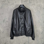 Balenciaga dark leather zip jacket with stand collar, ribbed cuffs, and front pockets