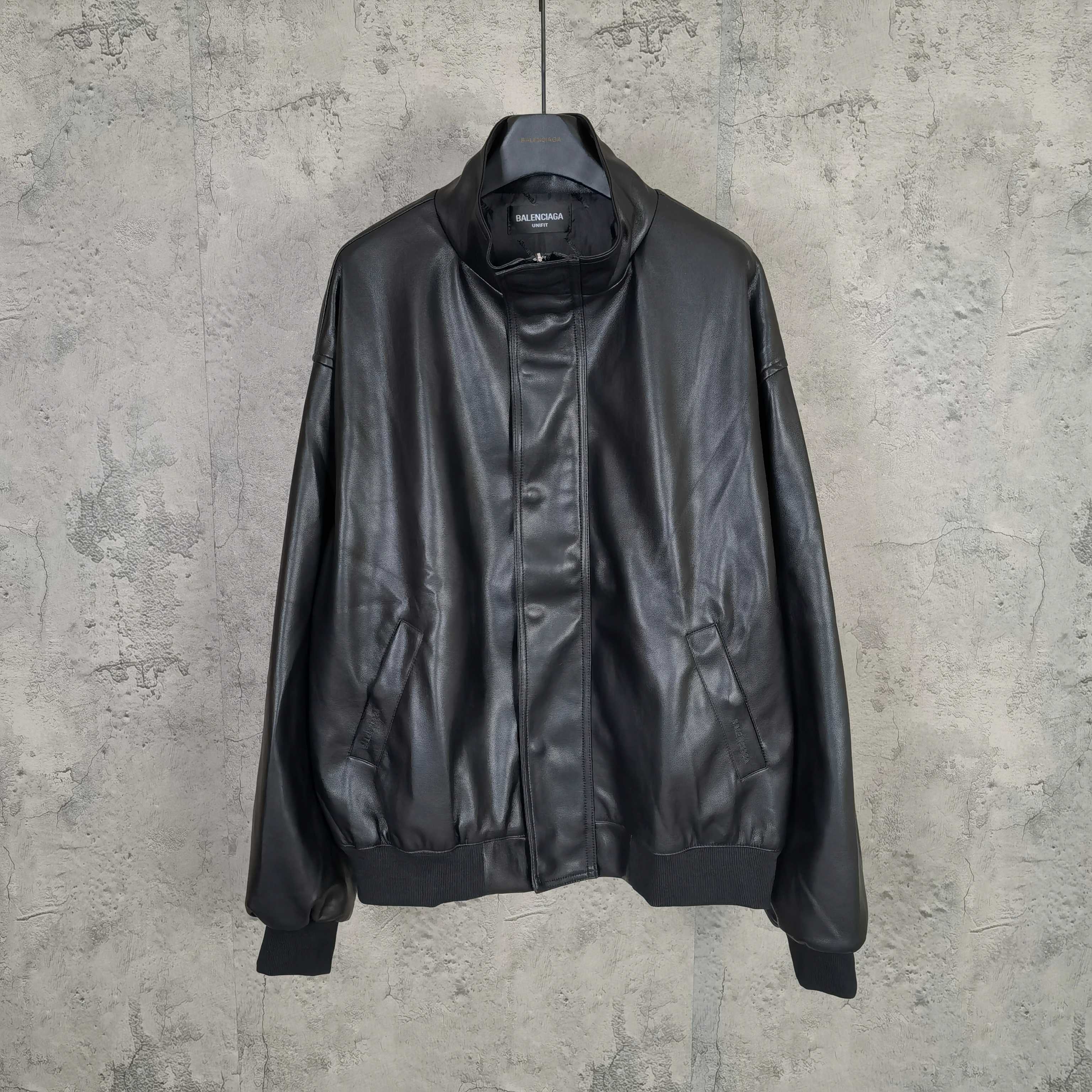 Balenciaga dark leather zip jacket with stand collar, ribbed cuffs, and front pockets
