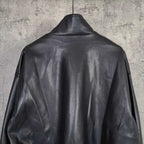 Balenciaga dark leather jacket back view with ribbed hem and sleeve details