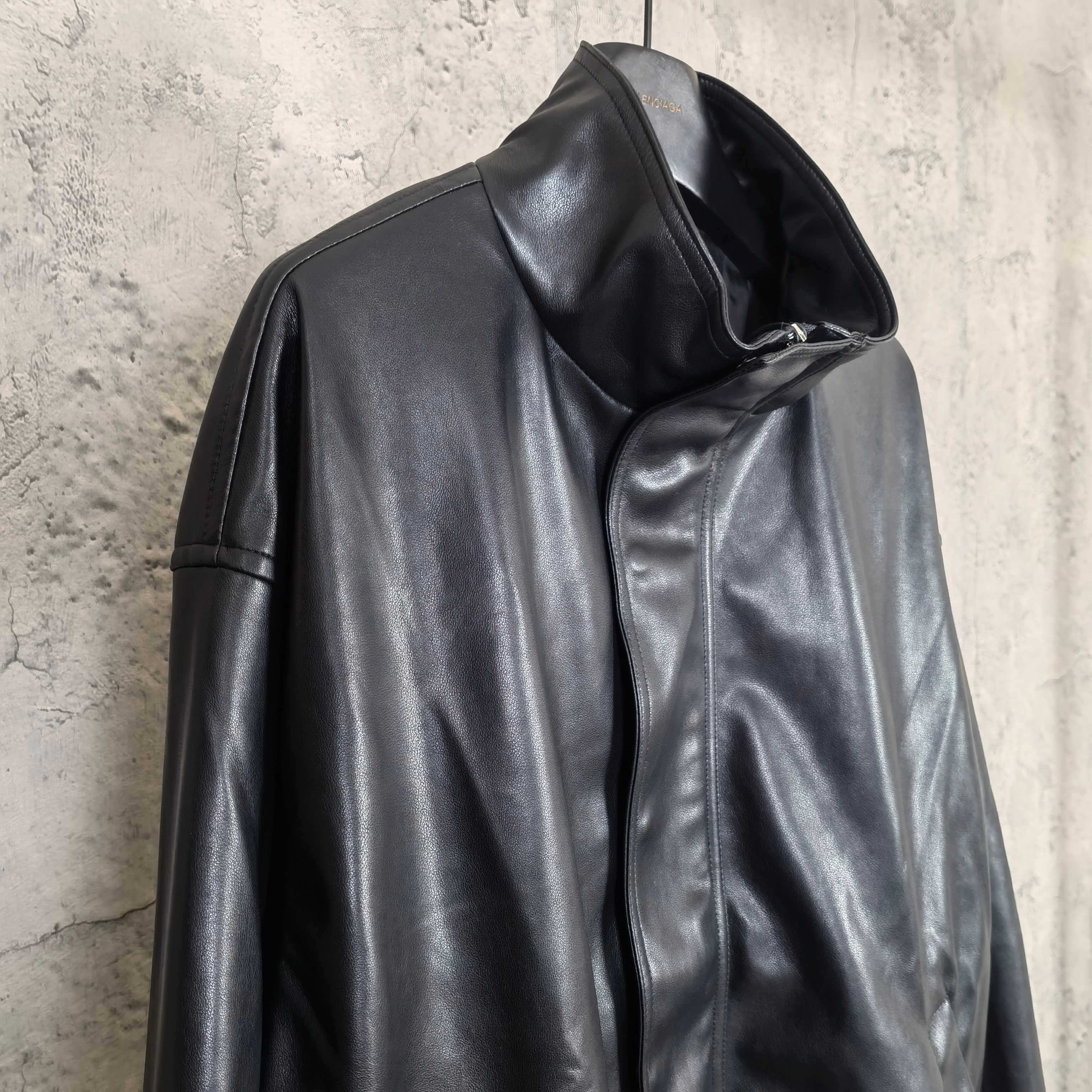 Balenciaga dark leather jacket with raised collar and zip front, side view