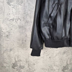 Balenciaga dark leather jacket sleeve and hem with ribbed cuff and pocket seam