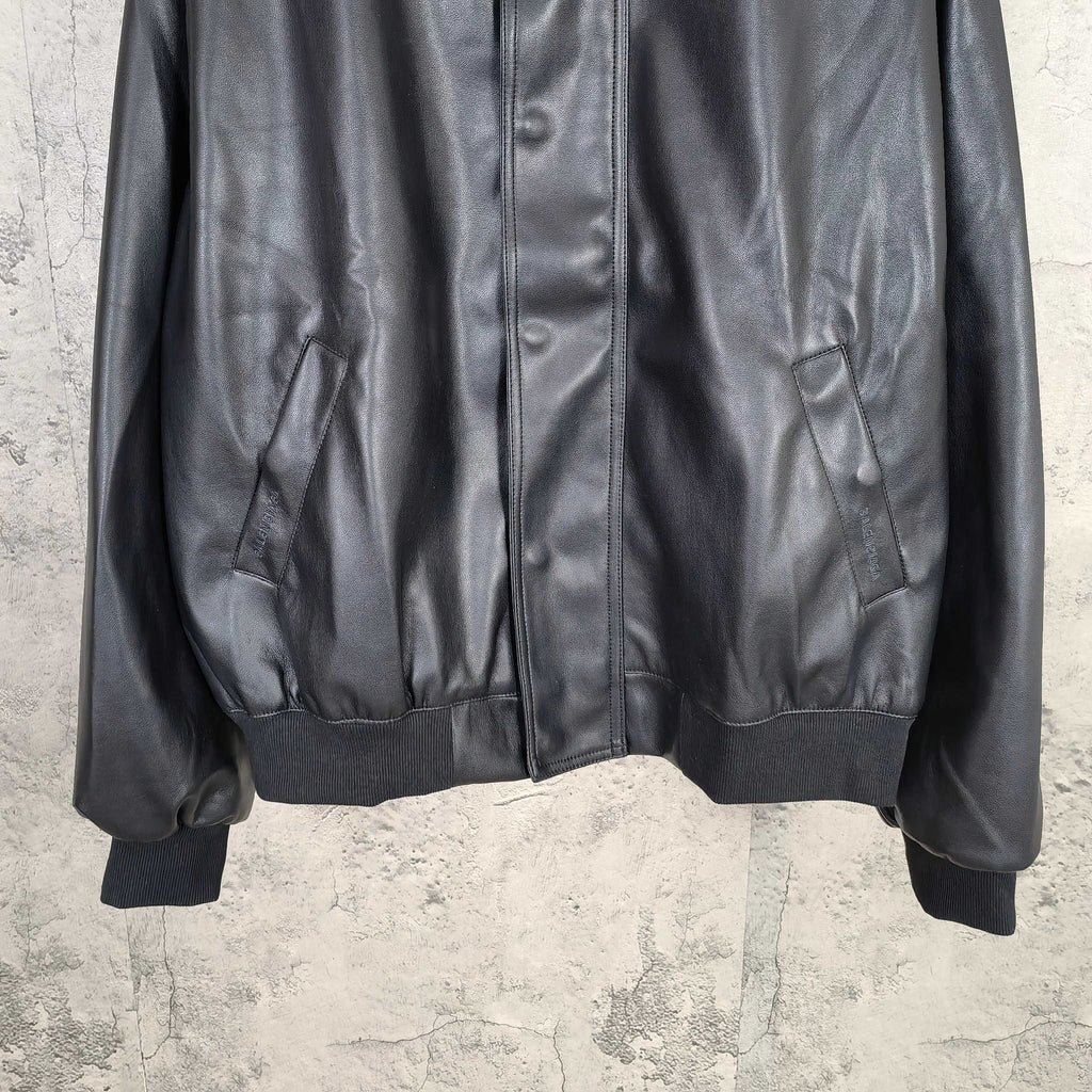 Balenciaga dark leather zip jacket with front pockets and ribbed sleeve cuffs