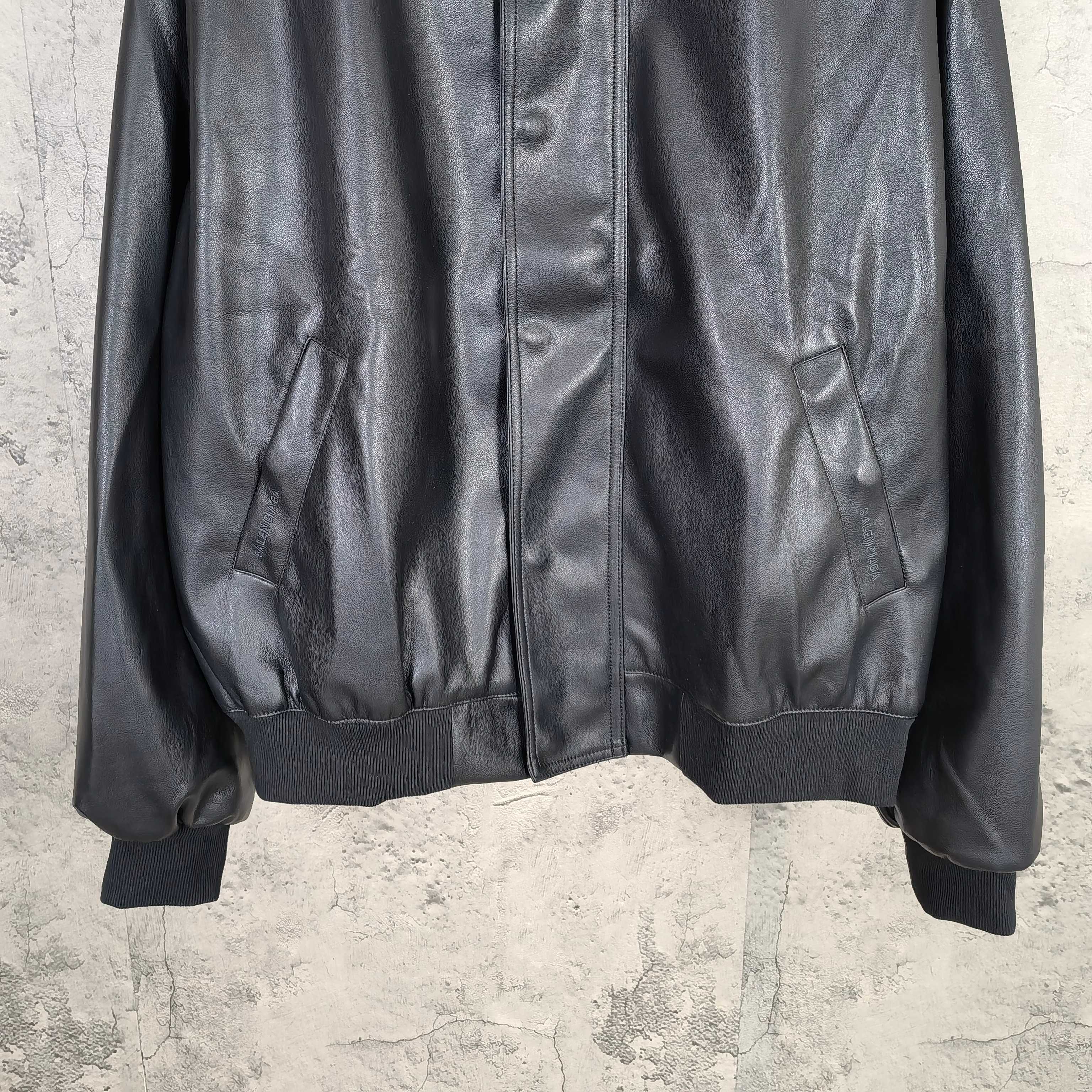 Balenciaga dark leather zip jacket with front pockets and ribbed sleeve cuffs
